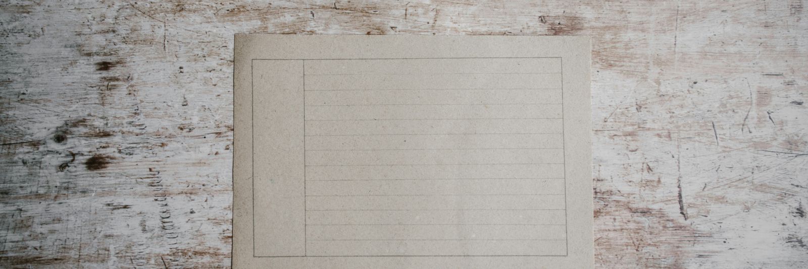 white paper on brown surface