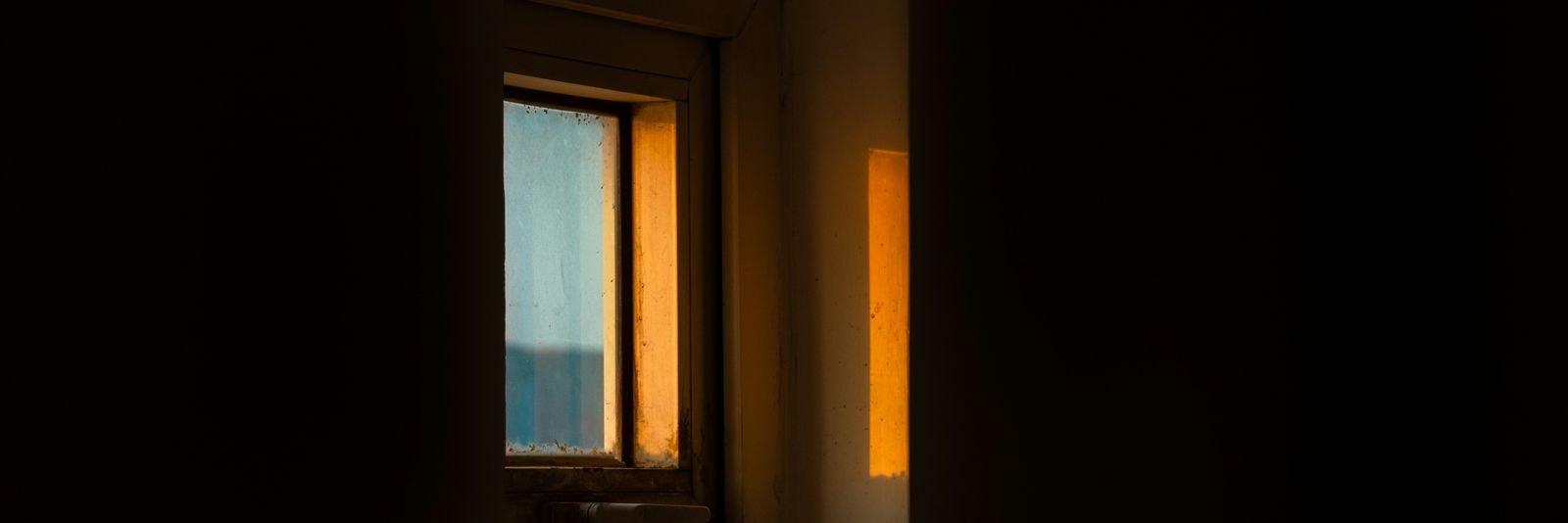 A window with a view of a body of water