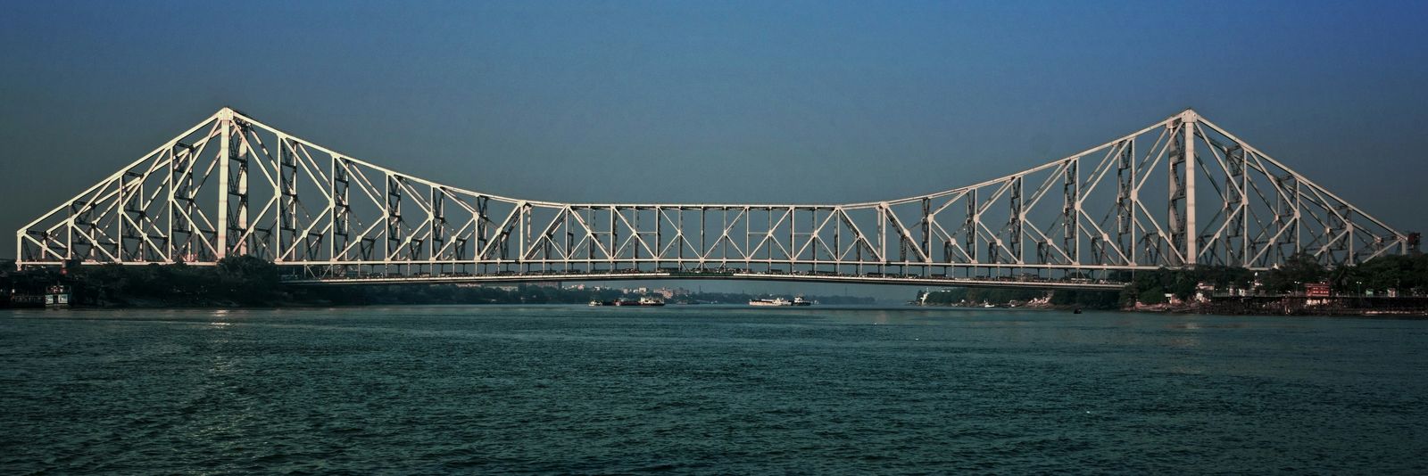 a large bridge spanning over a large body of water