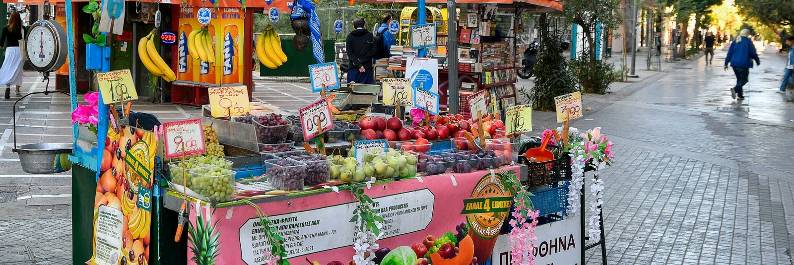A vibrant street stand selling fresh fruits and vegetables