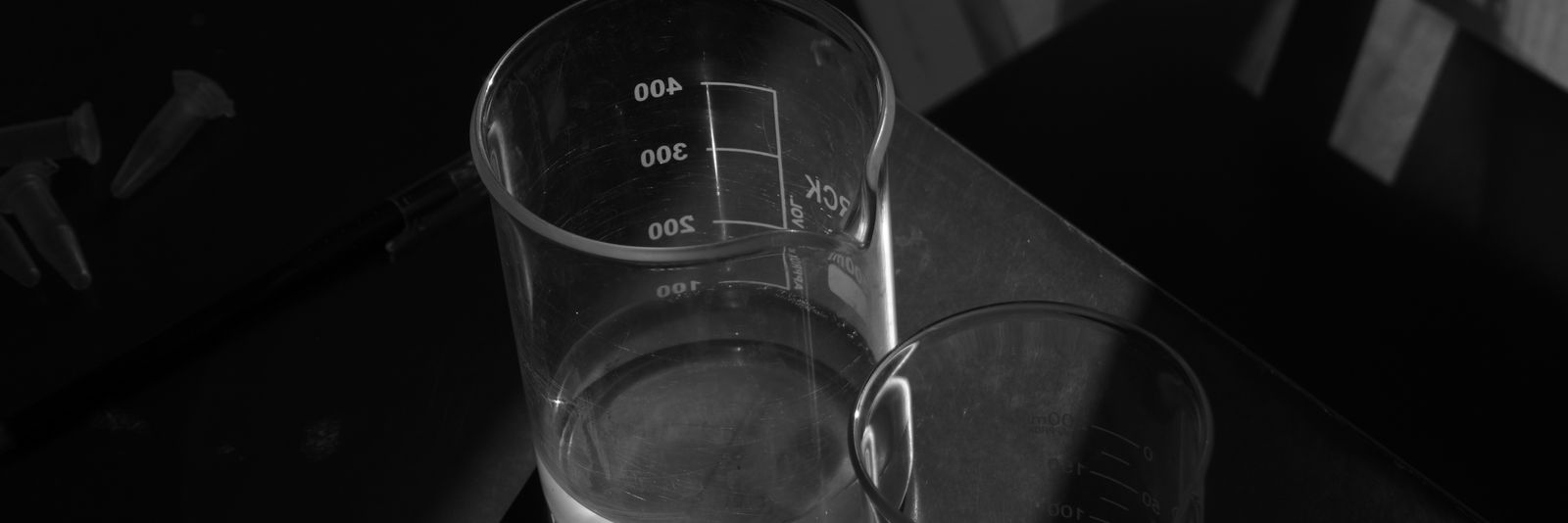A black and white photo of a glass of water
